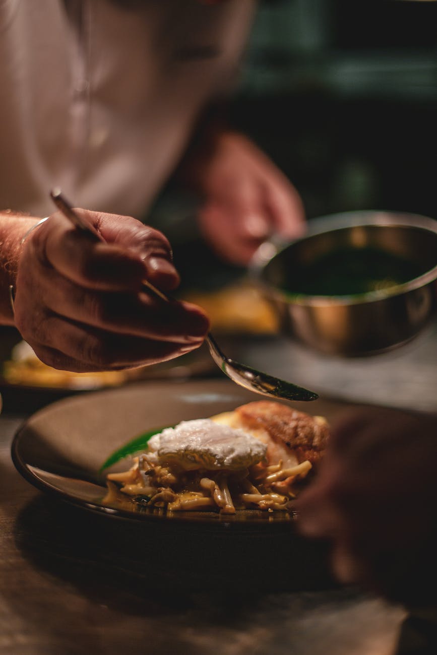 man decorating food